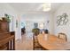 Open concept dining room offering hardwood floors, views of living room and lots of light at 422 Atwood St, Longmont, CO 80501