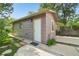 Exterior view of this unique home featuring a concrete walkway and an outside light fixture at 422 Atwood St, Longmont, CO 80501