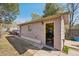 Exterior view of a charming shed with a peek into the colorful interior space at 422 Atwood St, Longmont, CO 80501