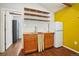 A bright kitchenette with wood cabinets and open shelving, plus a retro-style refrigerator at 422 Atwood St, Longmont, CO 80501