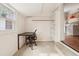 This bonus room has carpeting, a desk, a window, and shelving for storage at 422 Atwood St, Longmont, CO 80501