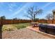 Spacious back yard featuring a cozy seating area, patio, and tree at 265 N Holcomb St, Castle Rock, CO 80104