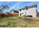 Large backyard with lawn, patio, outdoor furniture, and wooden fence at 265 N Holcomb St, Castle Rock, CO 80104