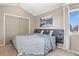 Comfortable bedroom with a vaulted ceiling, closet, and cozy decor with a large framed art piece at 265 N Holcomb St, Castle Rock, CO 80104