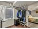 Bedroom area with garments rack, mini fridge, and window at 265 N Holcomb St, Castle Rock, CO 80104