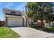 Charming two-story home with a brick and siding exterior and a well-maintained front yard at 265 N Holcomb St, Castle Rock, CO 80104