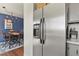 Bright dining area adjacent to the kitchen, featuring a modern stainless steel refrigerator at 265 N Holcomb St, Castle Rock, CO 80104