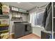 Laundry room with modern washer and dryer plus storage shelves at 265 N Holcomb St, Castle Rock, CO 80104