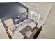 Spacious living room with vaulted ceilings, a large sectional sofa, and a window offering ample natural light at 265 N Holcomb St, Castle Rock, CO 80104