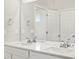 Elegant bathroom boasts double sinks, white countertop, and chrome fixtures at 9069 Pitkin St, Commerce City, CO 80022