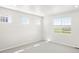 Bright bedroom with large windows, new carpeting, and abundant natural light at 9069 Pitkin St, Commerce City, CO 80022