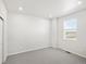Cozy bedroom features neutral carpet, window view, and ample natural light at 9069 Pitkin St, Commerce City, CO 80022