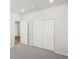 Bedroom featuring neutral carpet, closet with sliding doors, and bright interior at 9069 Pitkin St, Commerce City, CO 80022