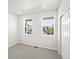 Bright room with neutral carpet, two windows providing natural light and storage closet at 9069 Pitkin St, Commerce City, CO 80022