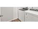 Well-lit laundry room with a new washer and dryer set for convenient chores at 9069 Pitkin St, Commerce City, CO 80022