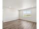 Spacious living room with large window offering natural light and views at 9069 Pitkin St, Commerce City, CO 80022