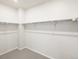A spacious walk-in closet with ample shelving and storage space at 9069 Pitkin St, Commerce City, CO 80022