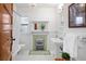 Classic bathroom with a vintage-inspired design, showcasing a clawfoot tub and pedestal sink at 1267 Clayton St, Denver, CO 80206