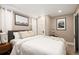 Spacious bedroom features natural light, soft bedding, and minimalist decor for a tranquil retreat at 1267 Clayton St, Denver, CO 80206