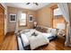 Comfortable bedroom with hardwood floors, natural light, and stylish decor at 1267 Clayton St, Denver, CO 80206