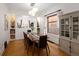 Bright dining room with hardwood floors, natural light, and stylish furnishings at 1267 Clayton St, Denver, CO 80206