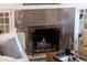 Cozy fireplace with a decorative silver tile surround, perfect for creating a warm and inviting atmosphere at 1267 Clayton St, Denver, CO 80206