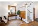 Elegant foyer with hardwood floors, ornate mirror, staircase, and decorative lighting fixtures at 1267 Clayton St, Denver, CO 80206