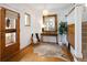 Elegant entryway with hardwood floors, a large mirror, and stylish decor, creating a welcoming ambiance at 1267 Clayton St, Denver, CO 80206