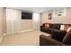 Comfortable living room features a plush couch and a mounted television for entertainment at 1267 Clayton St, Denver, CO 80206