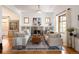 Comfortable living room featuring a fireplace, hardwood floors, and stylish decor at 1267 Clayton St, Denver, CO 80206
