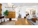 Bright living room featuring hardwood floors, white walls, staircase, and decorative lighting at 1267 Clayton St, Denver, CO 80206