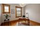 Home office with natural light, hardwood floors, and a traditional desk at 1267 Clayton St, Denver, CO 80206