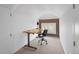 Cozy office space with hardwood floors and an exposed brick accent wall at 1267 Clayton St, Denver, CO 80206