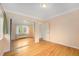 Bedroom with hardwood floors, natural light, and mirrored closet at 665 Washington St # 5B, Denver, CO 80203