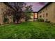 Cozy apartment building featuring a manicured lawn and inviting outdoor seating under a beautiful dusk sky at 665 Washington St # 5B, Denver, CO 80203