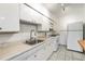 Practical kitchen featuring white appliances and ample counter space at 665 Washington St # 5B, Denver, CO 80203