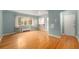 Bright living room featuring gleaming hardwood floors and ample natural light at 665 Washington St # 5B, Denver, CO 80203