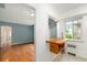 Open-concept living area with hardwood floors and natural light from a window at 665 Washington St # 5B, Denver, CO 80203