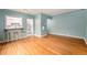 Open living area with breakfast bar, hardwood floors and kitchen view at 665 Washington St # 5B, Denver, CO 80203