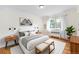 Inviting main bedroom with hardwood floors and a sun-filled window at 665 Washington St # 5B, Denver, CO 80203