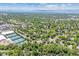 Wide aerial view showcasing neighborhood tennis courts and the surrounding community at 6330 E Vassar Ave, Denver, CO 80222