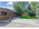 Covered patio and spacious backyard with a well-maintained lawn at 6330 E Vassar Ave, Denver, CO 80222