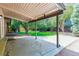 Covered patio with concrete flooring and a view of the backyard at 6330 E Vassar Ave, Denver, CO 80222