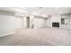 Finished basement with fireplace, neutral carpet, and recessed lighting at 6330 E Vassar Ave, Denver, CO 80222