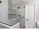 Contemporary bathroom with mosaic tile shelving, glass-enclosed shower, and modern fixtures at 6330 E Vassar Ave, Denver, CO 80222