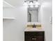 Bathroom vanity with granite countertop, dark wood cabinets, and modern lighting at 6330 E Vassar Ave, Denver, CO 80222