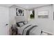 Comfortable bedroom showcasing soft gray walls, a queen bed, and ample natural light for a relaxing retreat at 6330 E Vassar Ave, Denver, CO 80222