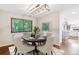 Dining room featuring an elegant table setting, modern light fixture, and a view of the outdoors at 6330 E Vassar Ave, Denver, CO 80222