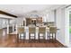 Spacious, updated kitchen with modern appliances, breakfast bar and stylish backsplash at 6330 E Vassar Ave, Denver, CO 80222