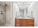 Updated bathroom with modern vanity, granite countertop, and tiled shower at 3131 E Alameda Ave # 1107, Denver, CO 80209